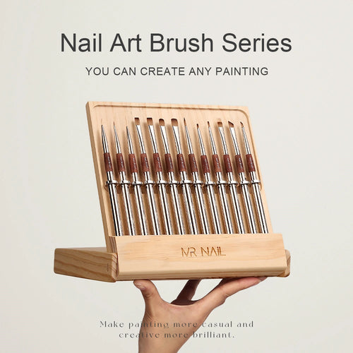 MR Nail Nail Art Brush Series full set displayed in a wooden brush holder and presented by hand in a studio setting, showing multiple professional nail brushes neatly arranged in a branded stand, designed for organized storage, easy brush access, creative nail painting, and professional manicure and nail art use